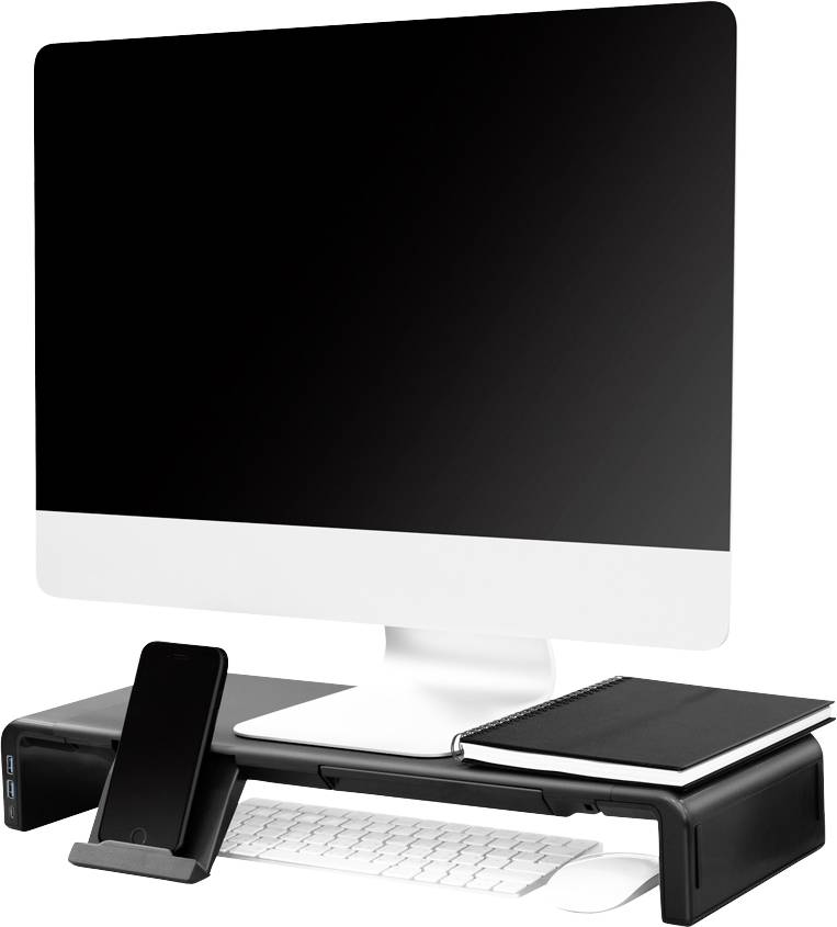 Monitor na stojaku, pod spodem klawiatura. Po lewej stronie smartphone w uchwycie, po prawej leży notes.