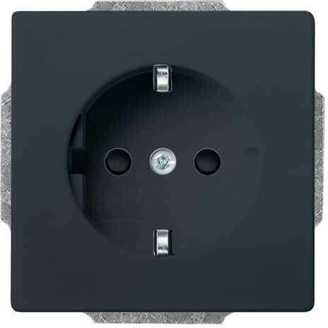 Czarna wtyczka w kwadratowej płycie, dwa okrągłe otwory, widoczne srebrzyste elementy styku.
