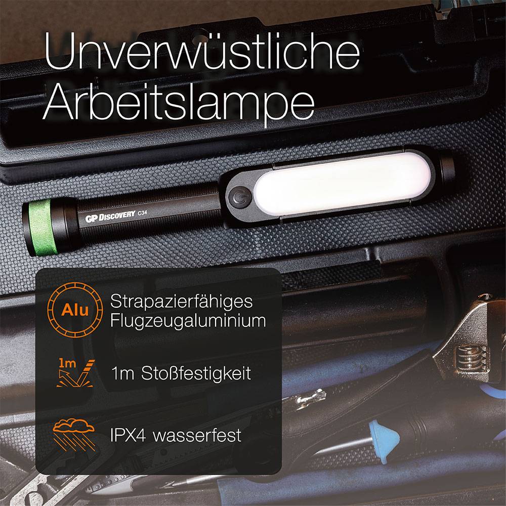 Lampa robocza leży na skrzynce narzędziowej. Tekst: 'Niezniszczalna lampa robocza', 'Aluminium', 'Wytrzymały stop aluminium lotniczego', 'Odporność na upadek z 1m', 'Wodoodporność IPX4'