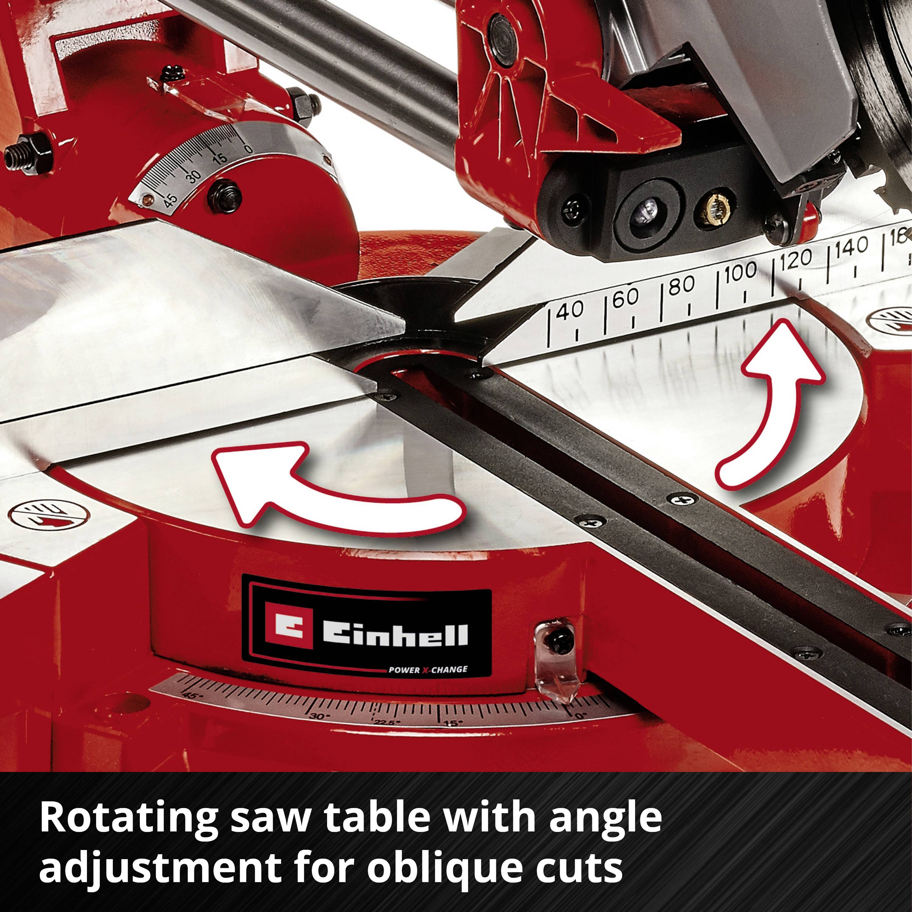 Czerwona piła z obrotowym stołem roboczym i regulacją kąta nachylenia. Strzałki wskazują kierunek obrotu.
