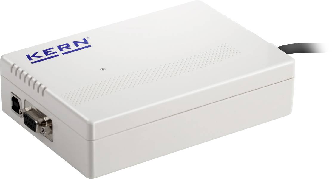 Biała elektroniczna skrzynka z logo 'KERN' na wierzchu. Po bokach znajdują się złącza do podłączenia przewodów.