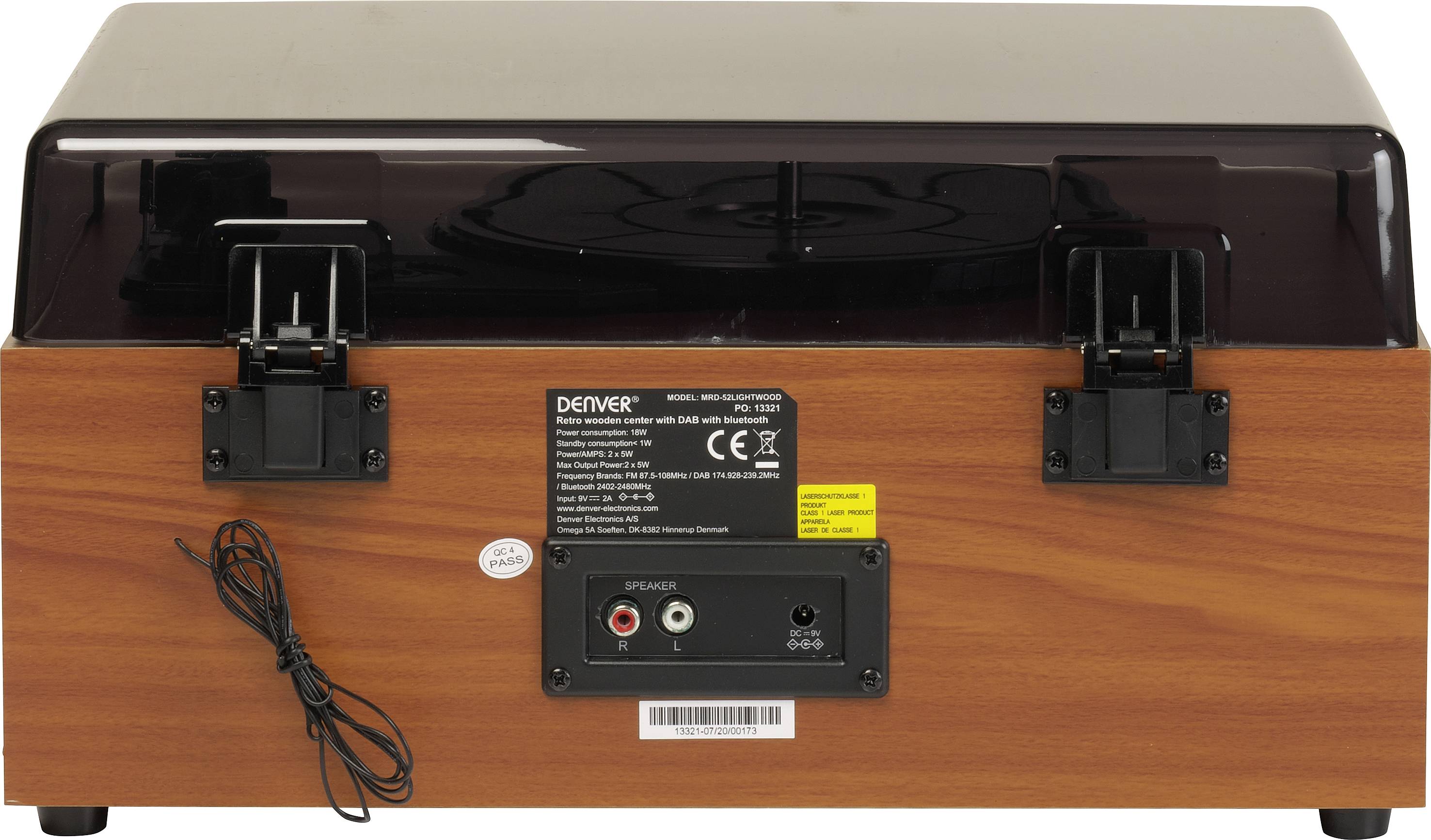 Zabytkowy gramofon w wyglądzie drewna z podłączeniami i tabliczką znamionową na tylnej stronie.