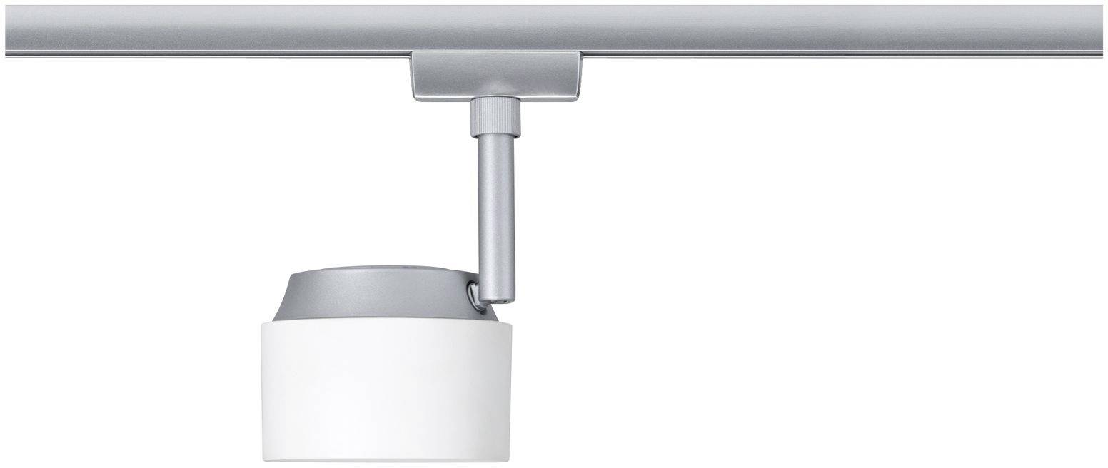 Nowoczesna, srebrna lampa sufitowa o cylindrycznym kształcie wisi na metalowej szynie.