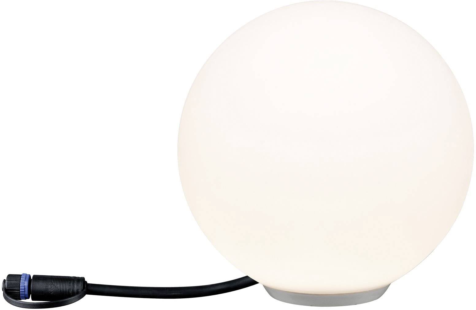 Okrągła, biała lampa do użytku na zewnątrz z czarnym przewodem zasilającym, umieszczona na stole.