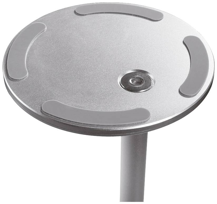 Okrągła, srebrzysta metalowa płytka z wypukłymi, zakrzywionymi liniami i wgłębieniem pośrodku, przymocowana do metalowego pręta.