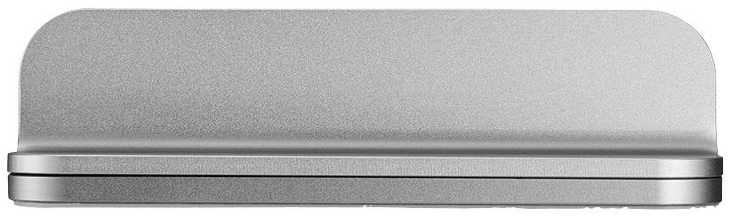 Srebrny, prostokątny, metalowy obiekt z zaokrąglonymi narożnikami, widziany z boku, stoi na płaskiej powierzchni.