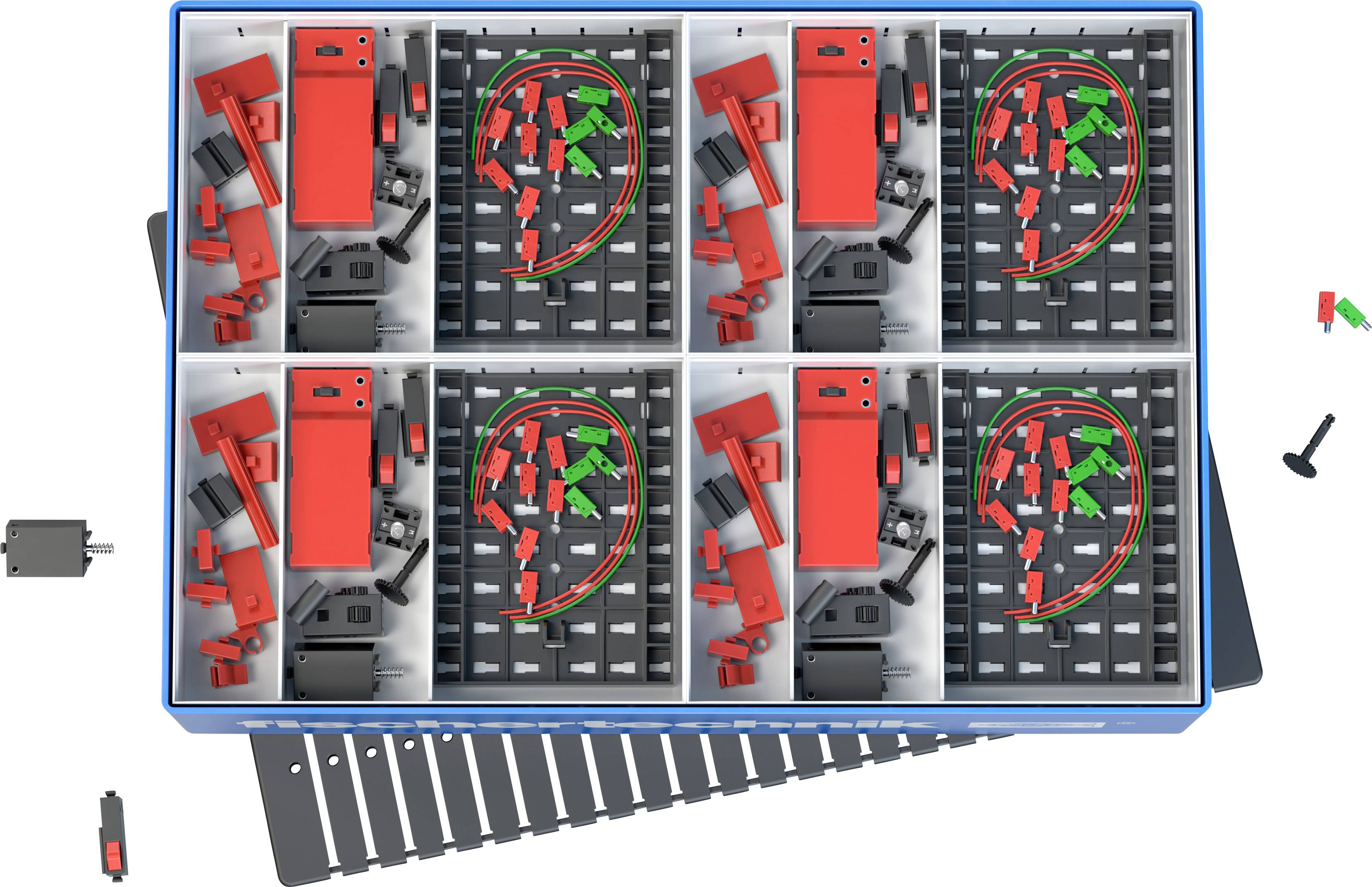 Skrzynka narzędziowa z wieloma przegródkami prezentuje czerwone i zielone narzędzia oraz drobne elementy. Niektóre narzędzia są umieszczone poza skrzynką.