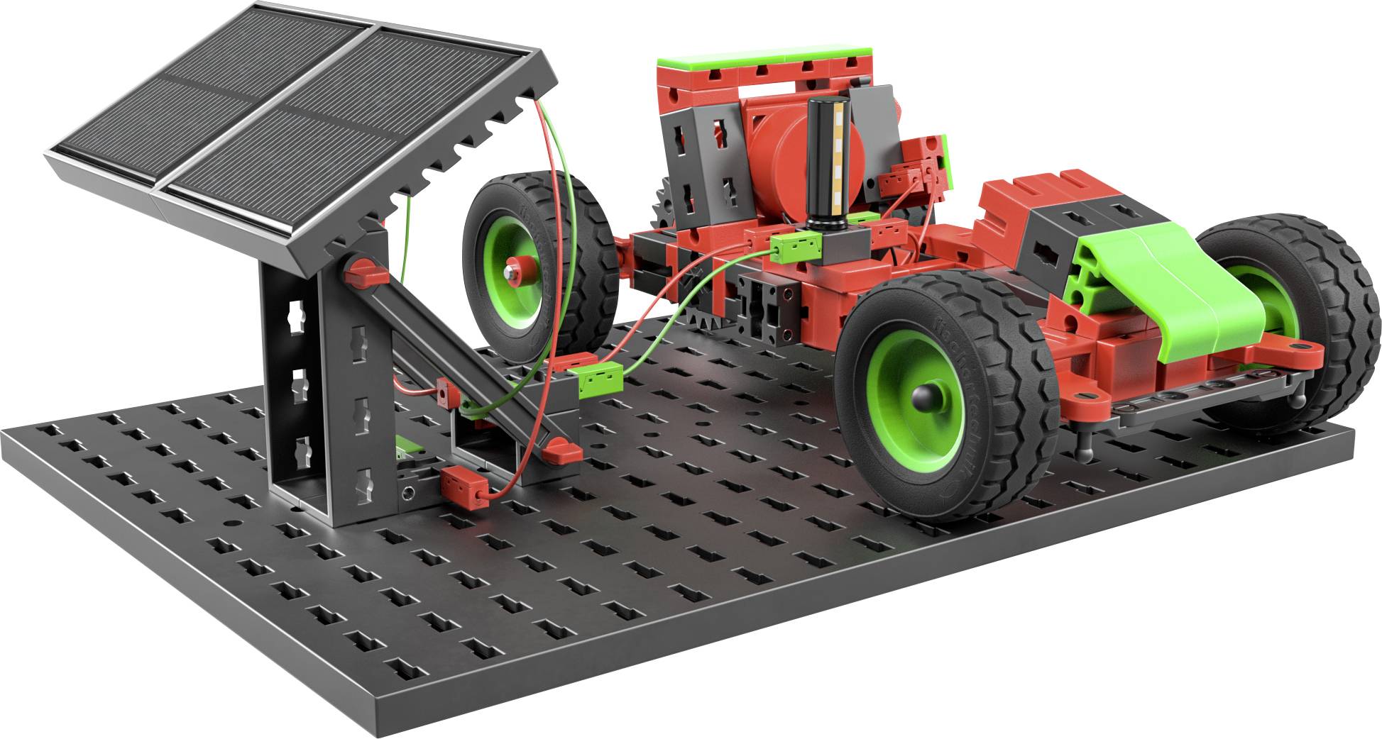 Kolorowy zestaw modelarski pojazdu solarnego z dużymi kołami stoi na platformie. Obok niego znajduje się panel słoneczny.