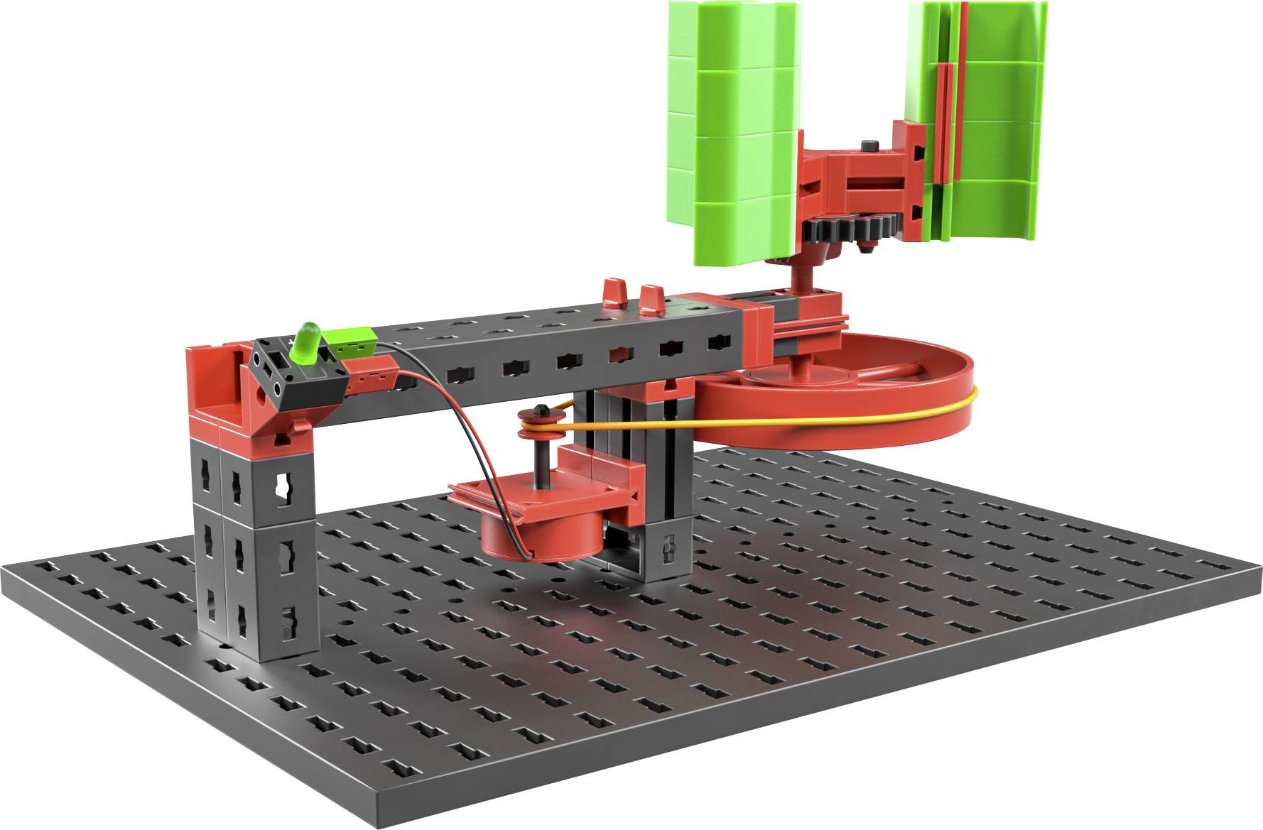 Model zestawowy z czerwono-czarnymi elementami na płycie siatkowej przedstawia obrotową strukturę z zielonymi modułami słonecznymi.