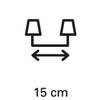 Symbol z dwoma naprzeciwległymi lampami i podwójną strzałką pomiędzy nimi wskazuje odległość 15 cm.