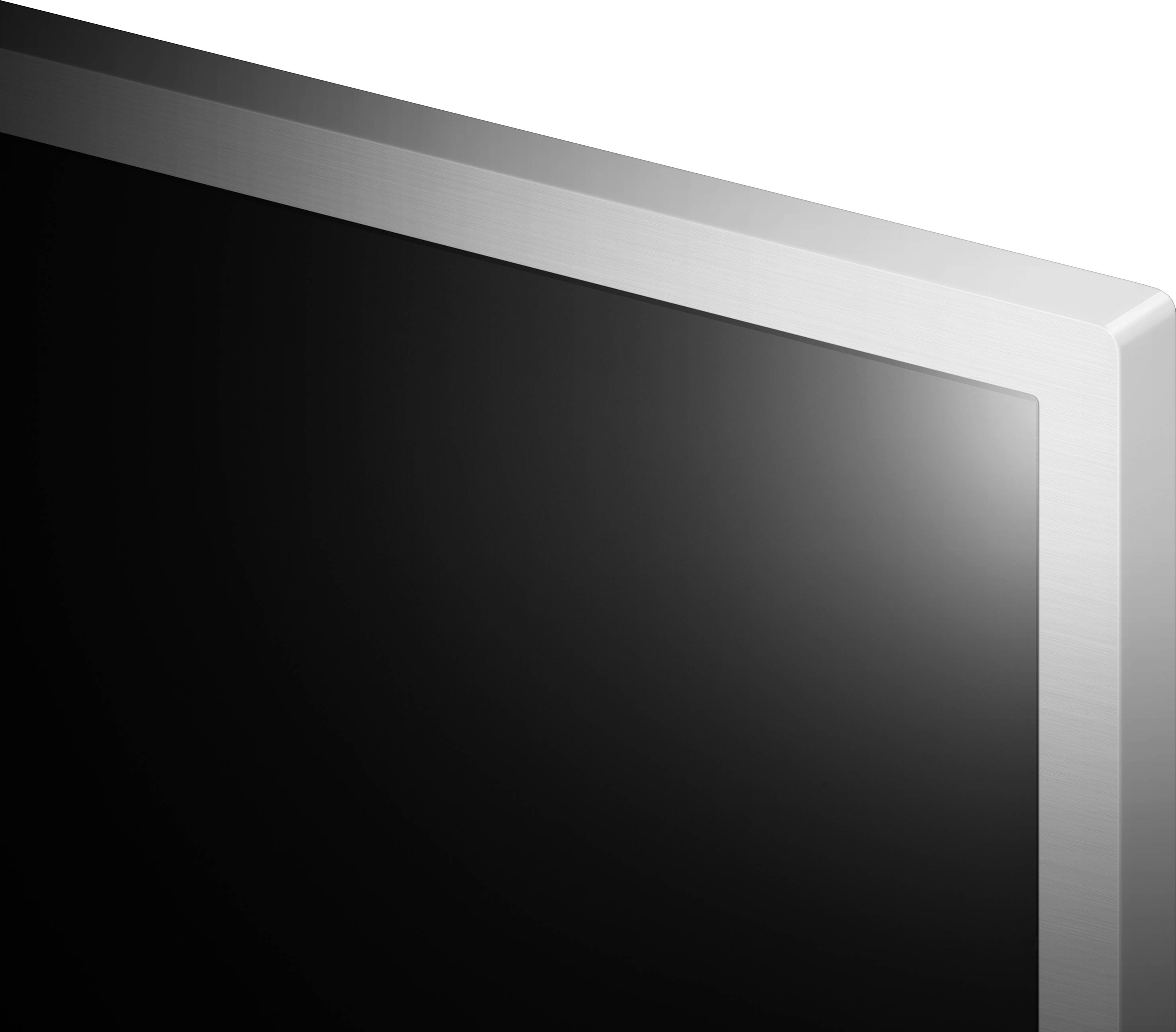 Róg płaskiego ekranu z srebrną ramką na białym tle.