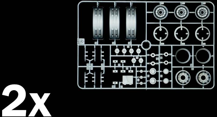 Elementy zestawu części składowych z komponentami opon na czarnym tle. W lewym dolnym rogu widnieje '2x', co wskazuje na dwa komplety tych części.