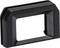 Czarna, prostokątna gumowa nakładka na wizjer aparatu, z zagłębionym otworem poprawiającym widoczność i komfort użytkowania.