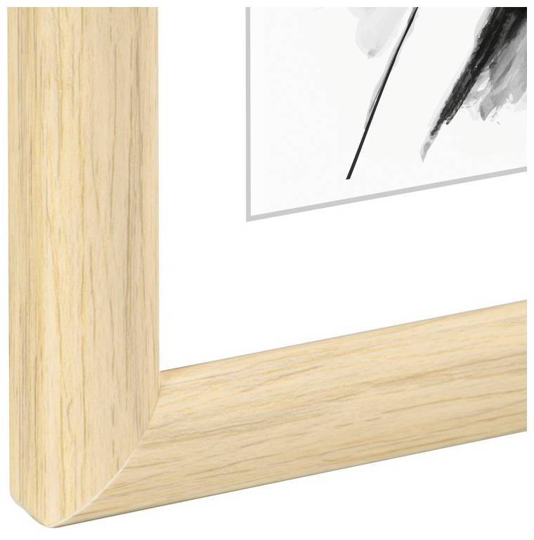 Drewniania rama ze złagodzonymi narożnikami, w której znajduje się czarno-białe dzieło sztuki. Obraz przedstawia abstrakcyjne linie i kształty.