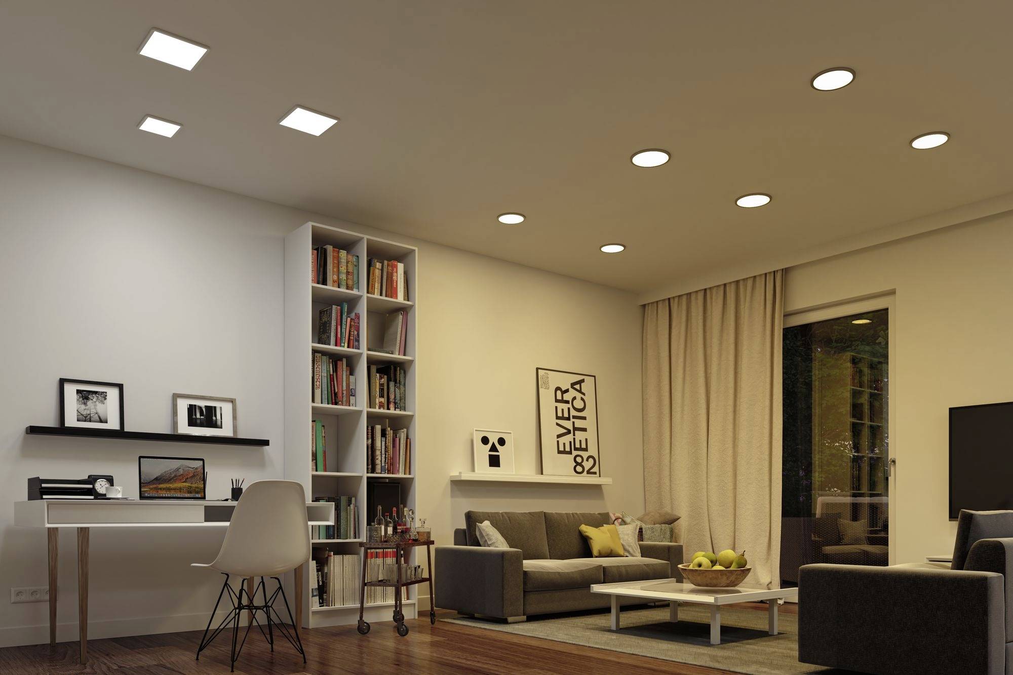 Salon z nowoczesnym wyposażeniem: biurko, regał na książki, szara sofa, stolik kawowy z misą owoców, ciepłe oświetlenie.