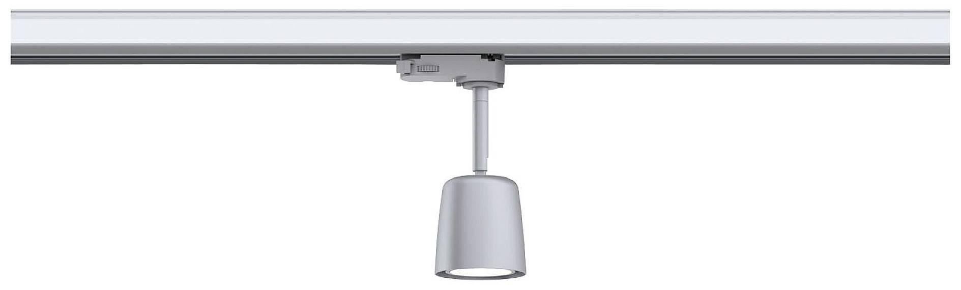 Szara lampa sufitowa jest przymocowana do szyny i zwisa w dół. Jest prosta i nowoczesna w stylu.