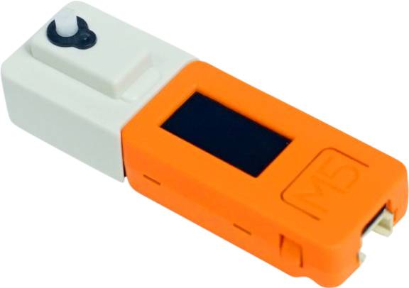 Obraz przedstawia pomarańczowe, przenośne urządzenie elektroniczne z małym wyświetlaczem z napisem 'M5'.