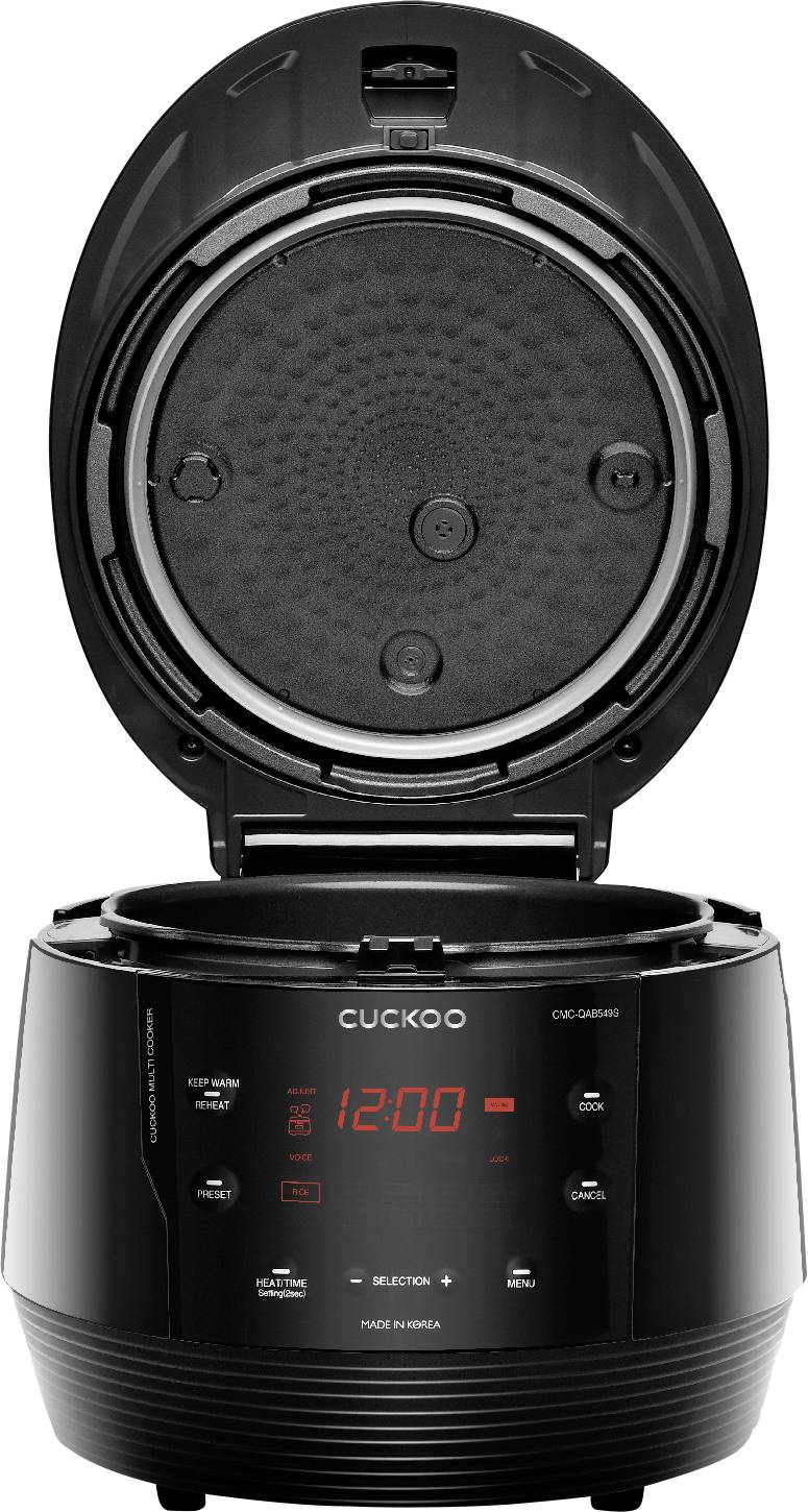 Czarny ryżowar z otwartą pokrywą. Na przedniej części znajduje się wyświetlacz cyfrowy z czerwonymi cyframi i symbolami.