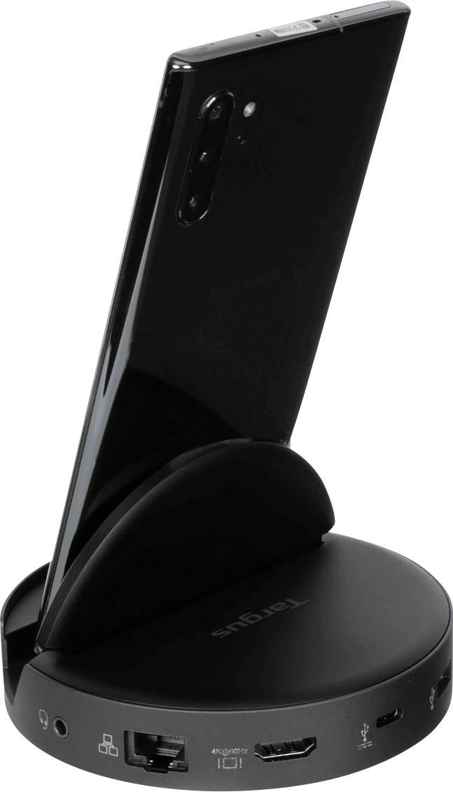 Smartfon w czarnej stacji dokującej z portami takimi jak Ethernet i HDMI.