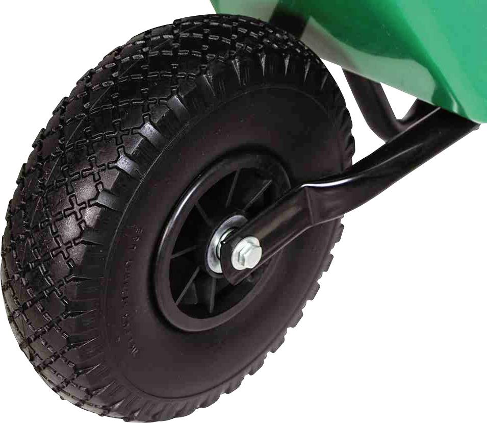 Zbliżenie czarnego koła z grubym bieżnikiem, zamontowanego na zielonym urządzeniu; przedstawia stabilność i mobilność obiektu.