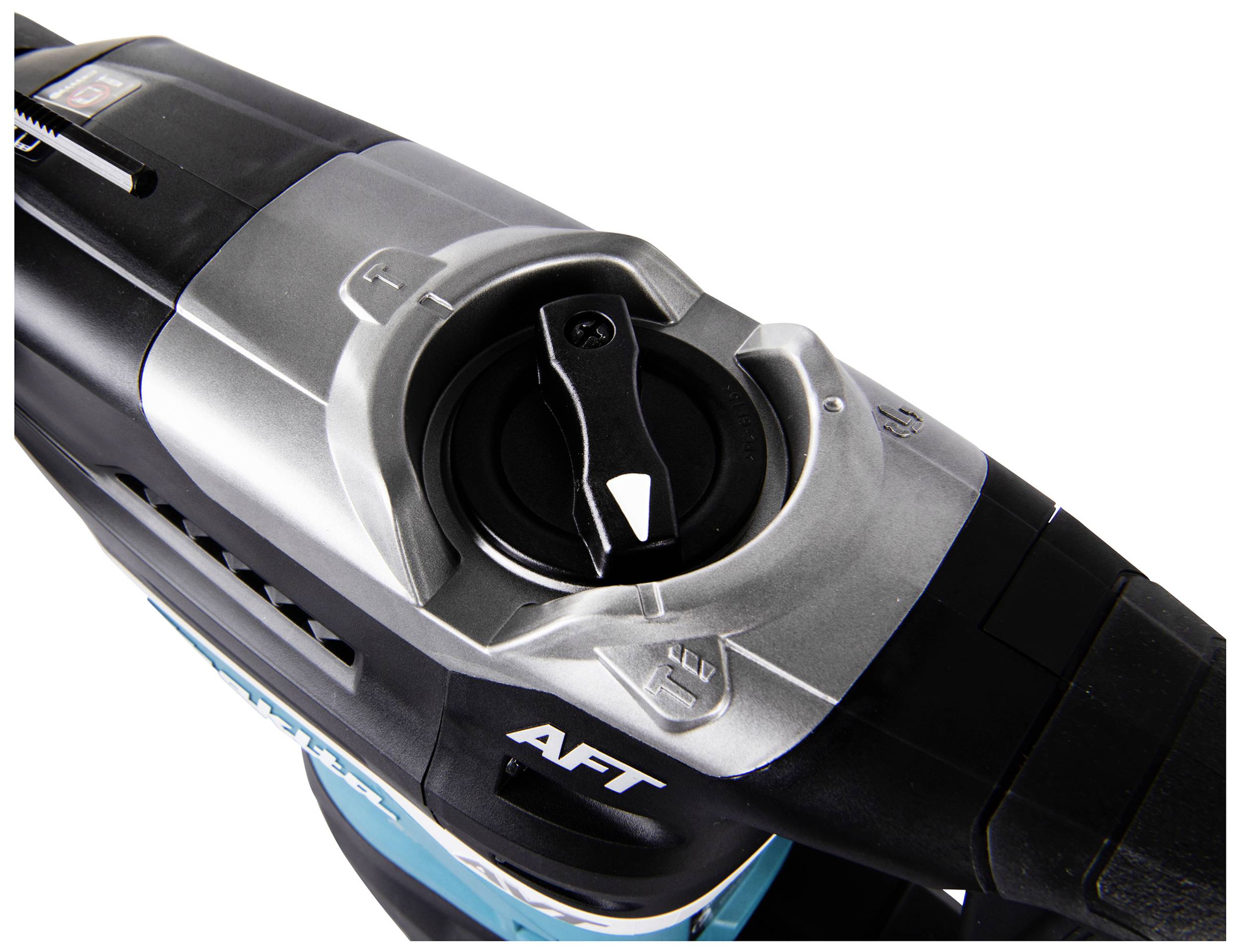 Kąt urządzenia z bliska, powierzchnia srebrno-czarna z dźwignią i napisem 'AFT'.