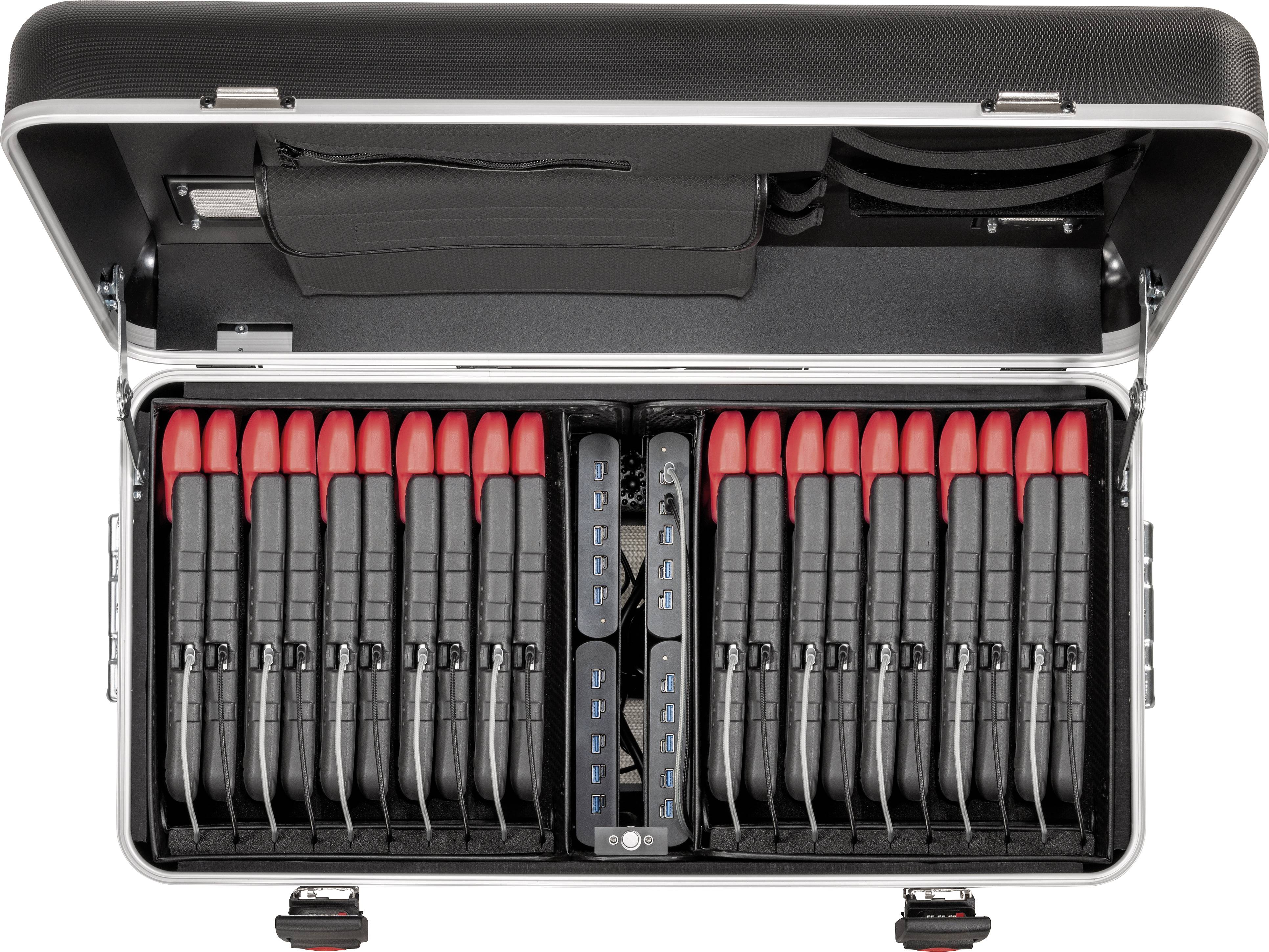 Otwarty kuferek z kilkoma czarnymi urządzeniami zakończonymi czerwonymi elementami, ułożonymi w dwóch rzędach. Widoczne boczne przegródki u góry.