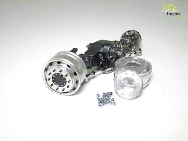 Model napędu pojazdu z kołami i śrubami, sfotografowany z góry. W tle widoczne jest logo 'thicon'.