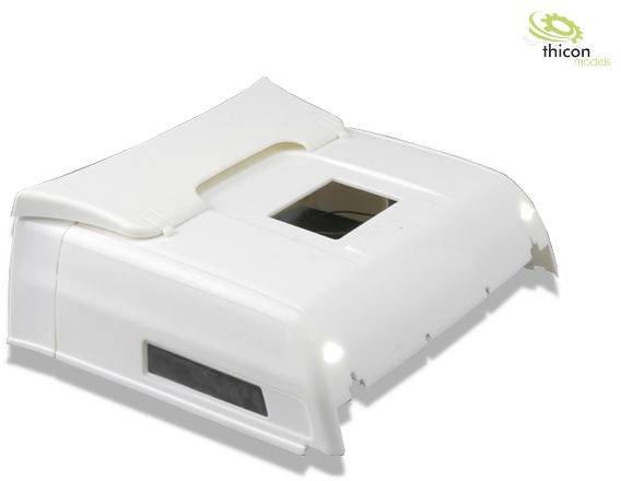 Białe plastikowe obudowa z kwadratowym otworem na górze i dwoma małymi światłami z przodu. Logo 'Thicon models' w prawym górnym rogu.