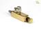 Mała, prostokątna część mosiężna z gwintowanymi i zaworowymi przyłączami, stosowana w zastosowaniach technicznych lub mechanicznych.