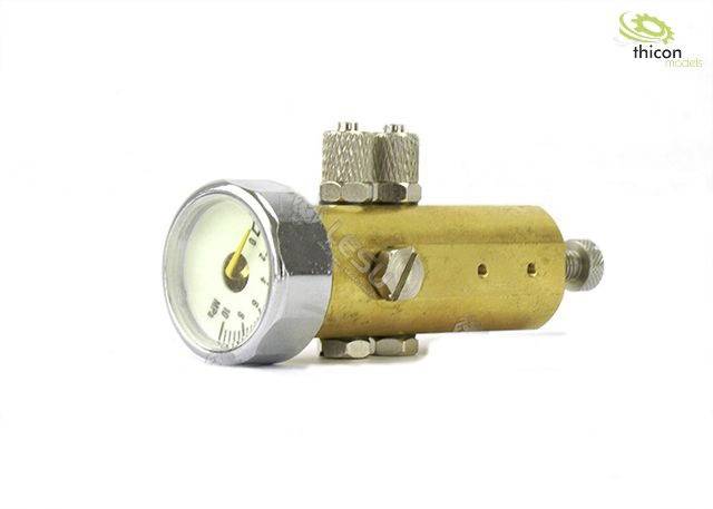 Przyrząd pomiarowy Messinga z wyświetlaczem ciśnienia i zaworami przyłączeniowymi, prawdopodobnie stosowany w systemach hydraulicznych lub pneumatycznych.