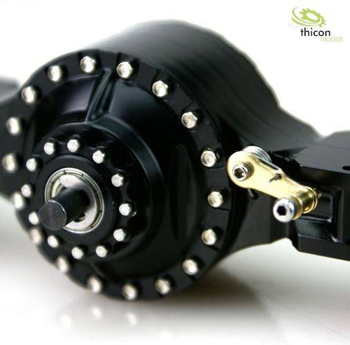 Zbliżenie czarno-metalowej części maszyny z wieloma śrubami i dźwignią. W tle logo 'thicon models'.