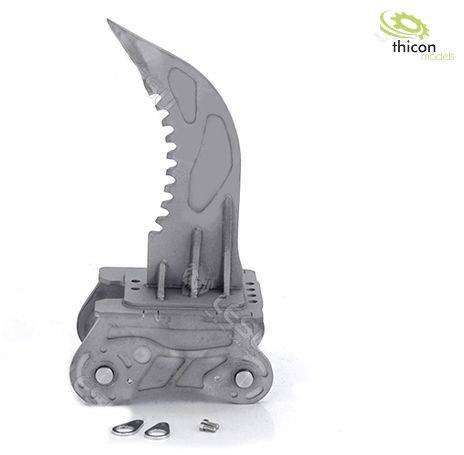 Szara grupa elementów metalowych z ząbkowanym ostrzem i wieloma częściami, obok leżą dwie małe płytki i śruba. Logo w prawym górnym rogu.