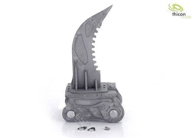 Szary, mechaniczny model szponu z ząbkowanym ostrzem, zamontowany na podstawie, obok leżą dwa małe metalowe pierścienie.