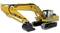 Żółta koparka z długim wysięgnikiem i łyżką. Porusza się na gąsienicach i jest przeznaczona do prac ziemnych.