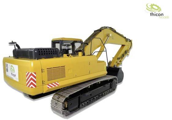 Żółty model koparki gąsienicowej na białym tle. Logo marki 'thicon models' w górnym prawym rogu.