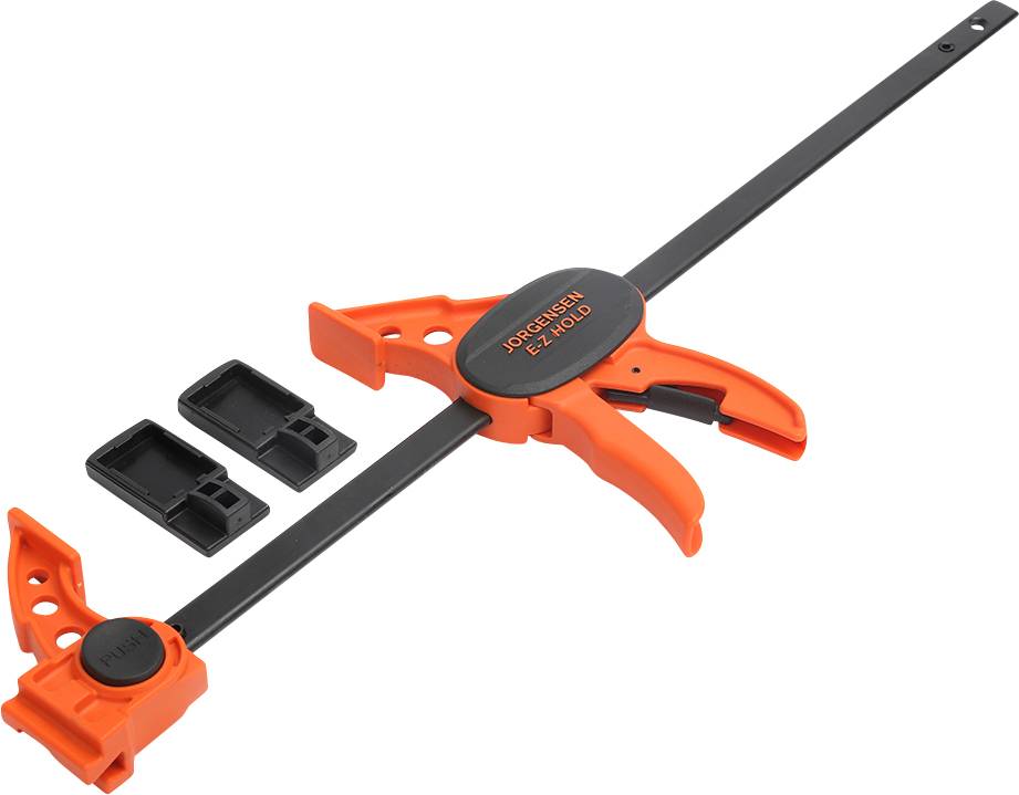 Pomarańczowy plastikowy zacisk z czarną stalową belką, mechanizmem uchwytu do mocowania oraz dwoma zdejmowanymi końcówkami.