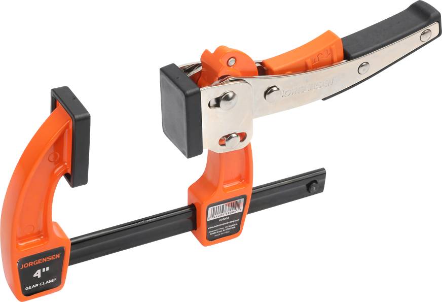 Pomarańczowe zaciski Jorgensen z czarnym przesuwnym elementem. Stosowane do mocowania elementów podczas obróbki lub łączenia.