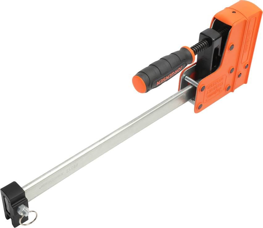 Pomarańczowy łom ze스라이owym zaciskiem, czarnym uchwytem i srebrnym prętem, używany do przytrzymywania podczas otwierania drzwi lub okien.