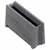 Czarno-szara, prostokątna część plastikowa z pionowymi żebrami po bokach i otwartym wcięciem u góry.