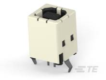 Mały biały elektryczny złącze z metalowymi stykami i segmentowaną obudową do obwodów elektronicznych.