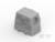Szary, sześcienny element budowlany z okrągłymi otworami po bokach; dwa wystające czopy od spodu.