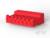 Czerwona plastikowa część o prostokątnym kształcie, z wieloma nacięciami i paskami. Leży na białej powierzchni.