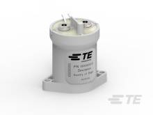 Mały cylindryczny czujnik elektroniczny z końcówkami przyłączeniowymi. Etykieta wskazuje 'Kraj pochodzenia' oraz numer modelu.