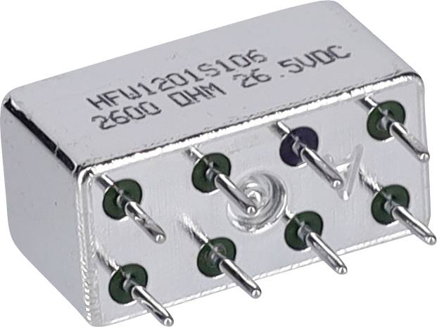 Mały metalowy element elektroniczny z wieloma wystającymi pinami, oznaczony etykietą 'HFW1201S106 2600 Omów 26,5VDC', stosowany w obwodach elektrycznych.