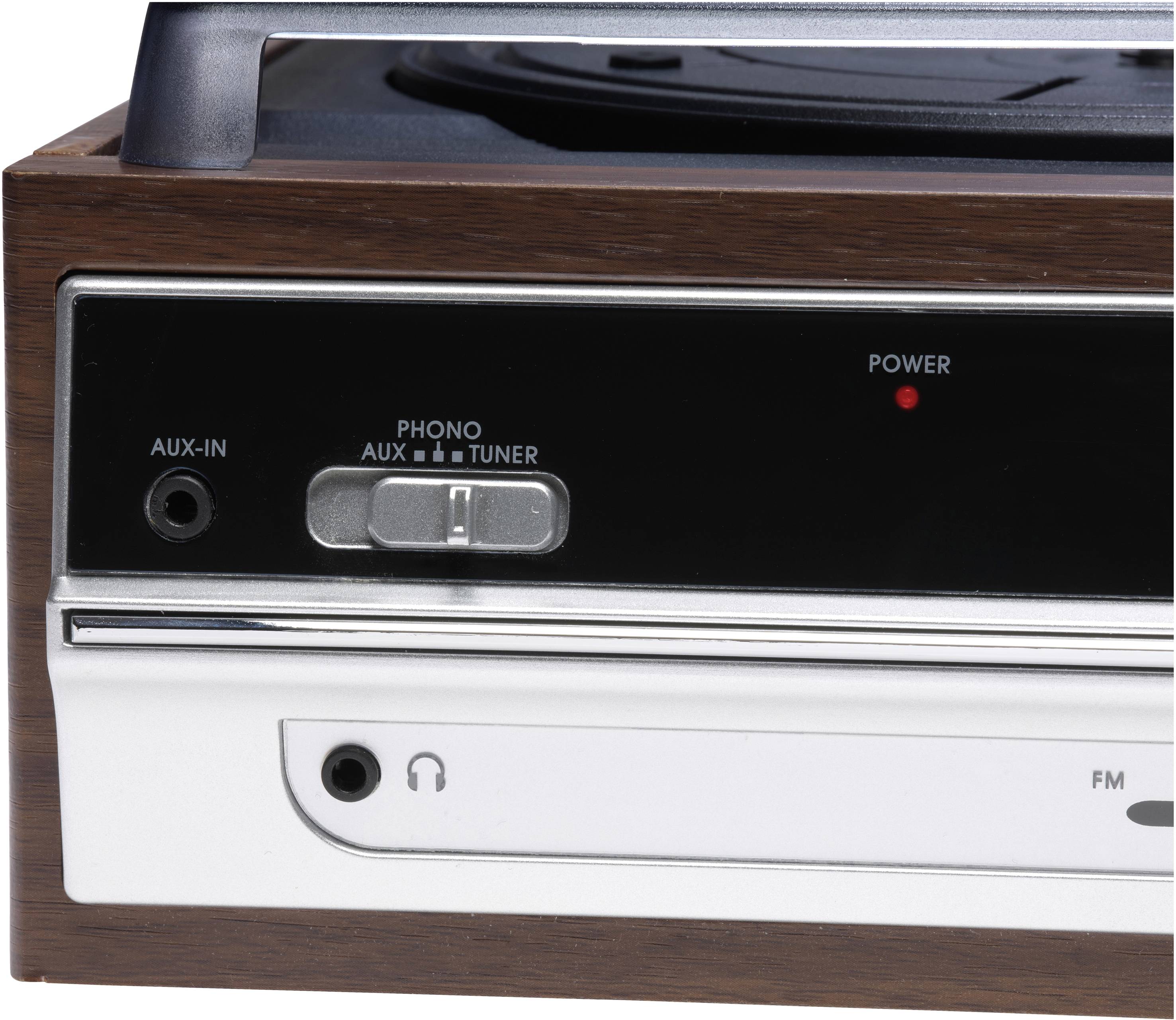 Zbliżenie na retro gramofon z panelem sterowania, na którym widać przyciski 'AUX' i 'Tuner' oraz wskaźnik zasilania.