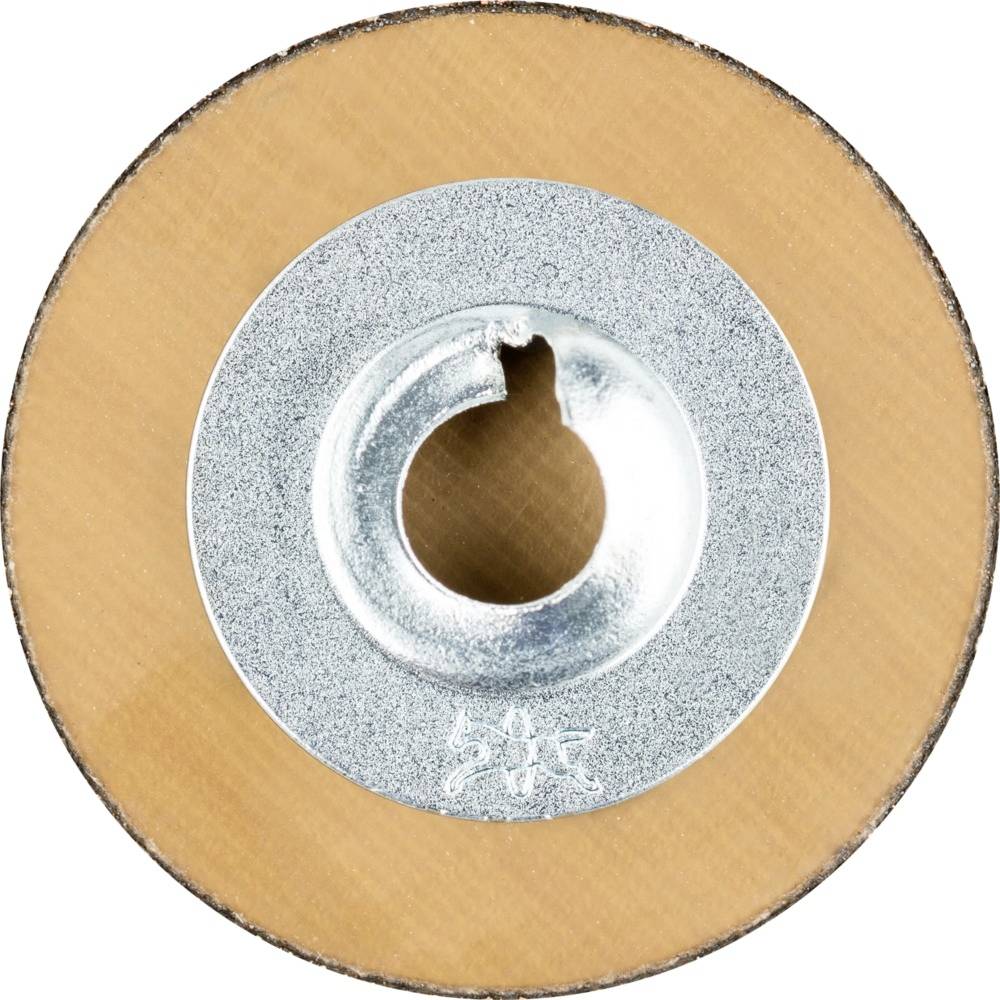 Zbliżone zdjęcie tarczy szlifierskiej. W centrum znajduje się metalowa tarcza z otworem. Widoczna jest tekstura powierzchni ściernej.