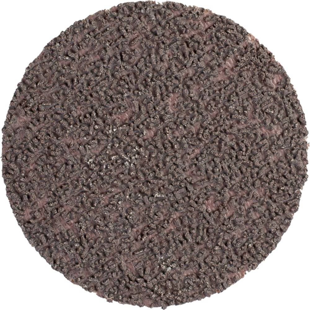 Okrągła, ciemnoczerwona tarcza ścierna o grubej ziarnistości, używana do obróbki powierzchni metalowych.