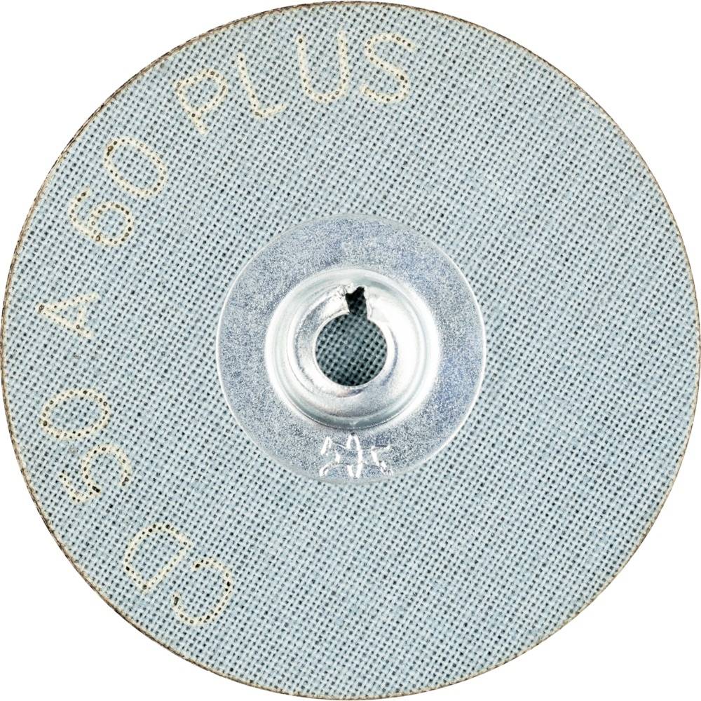 Krążek papieru ściernego z napisem '50 A 60 PLUS'. Posiada centralne otwór i jest przeznaczony do prac szlifierskich.