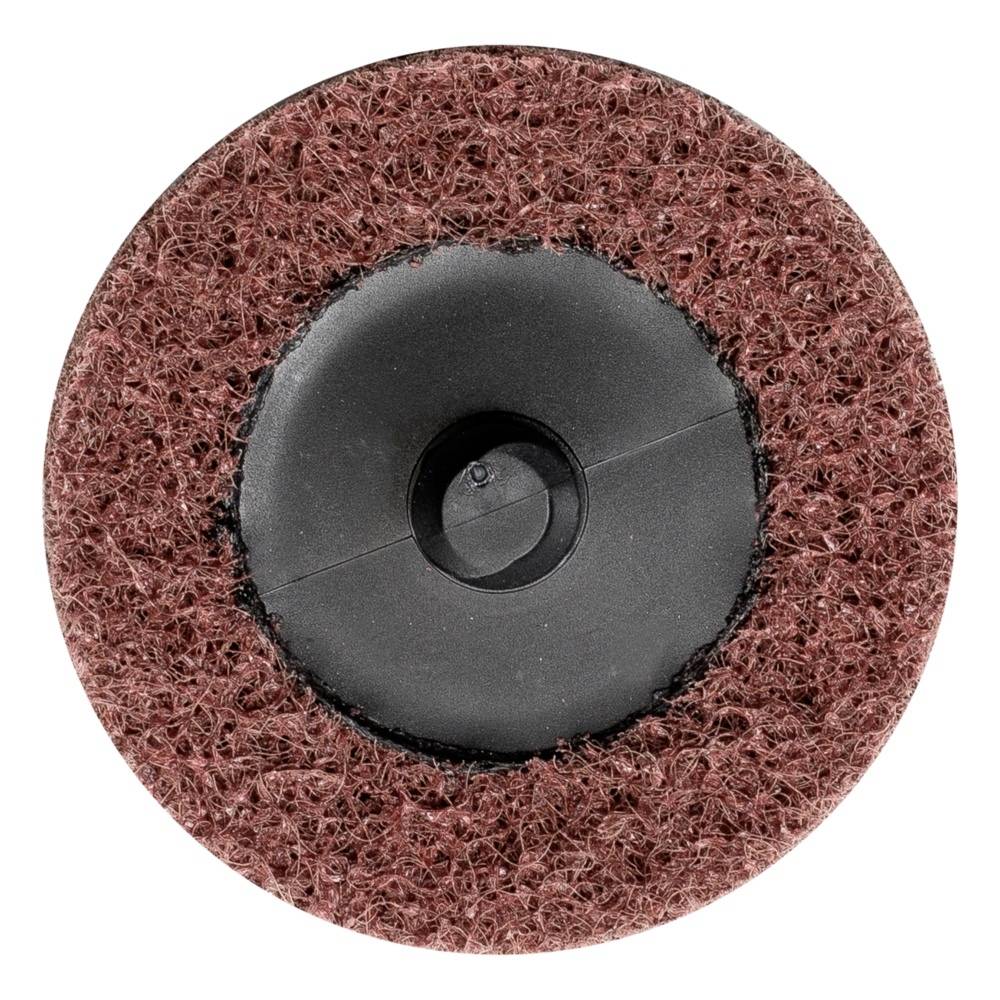 Brązowa, okrągła tarcza szlifierska z czarnym plastikowym centrum, sfotografowana z góry, ukazuje strukturę i materiał pady.