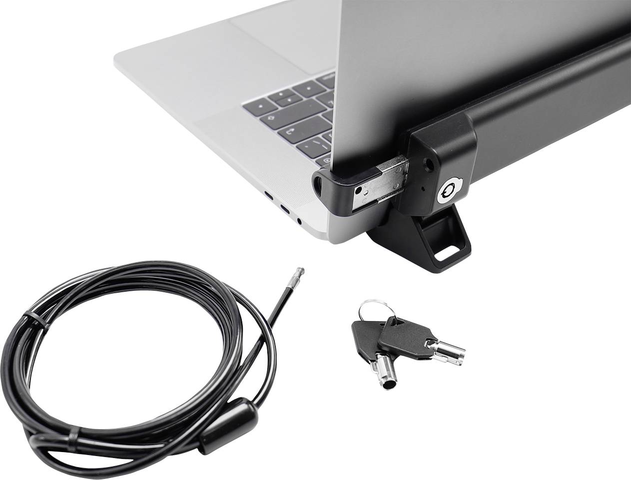 Laptop jest zabezpieczony zamkiem bezpieczeństwa. Obok niego leży długi kabel z kluczem i dwoma kluczami zapasowymi.